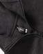A 1/2 zip collar fleecy jumper in dark grey, featuring a hang tag and a zip closure. It has a logo.