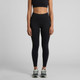 Active seamless leggings in black, styled with a matching crop top and trainers. The product features a logo.
