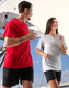 A unisex cotton tee in black and grey, displayed by a man and woman, featuring a logo on the garments.