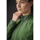 A woman in a green jacket with a zippered collar, featuring a subtle texture and fitted design. The jacket has a logo.