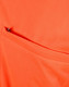 An orange polo shirt featuring a vented pocket, showcasing a breathable fabric texture.