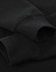 A black crew fleece jumper featuring ribbed cuffs, showcasing a soft fabric texture. It has a branding logo.