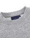 A grey crew fleece jumper with a round neckline and a tag featuring logos.