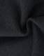 A close-up of dark grey fabric, showcasing a soft and textured fleece material suitable for jumpers.