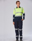 A long-sleeved safety polo in neon yellow and navy, featuring reflective stripes and a logo. Suitable for workwear.