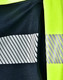 A navy jumper with reflective stripes and high visibility yellow accents, featuring a logo.
