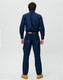 A pair of navy work pants with a straight fit, featuring cargo pockets, displayed from the back.