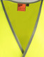 A bright yellow safety vest with reflective shoulder tapes and a grey trim, featuring a logo label.