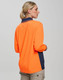 A long-sleeved, high-visibility polo shirt in orange with navy accents and a logo on the chest.