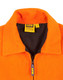 An orange safety jacket featuring a zippered collar and a black inner lining, with a logo present.