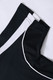 A black polo shirt featuring white accents and a logo at the collar. The fabric appears textured.