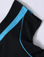 A black polo shirt with light blue detailing at the collar and shoulder, featuring a logo.