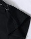 A black kids' polo shirt with a collar and short sleeves, featuring a logo.