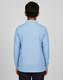 A back view of a light blue long-sleeved polo shirt with a collar, featuring a logo.