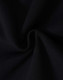 A close-up of black fleecy fabric, showcasing the soft texture and swirl pattern.