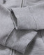 A close-up of a grey ladies' full-zip fleecy hoodie, featuring soft fabric and ribbed cuffs.