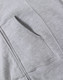 A grey ladies' full-zip fleecy hoodie featuring a front pocket and soft fabric texture. The hoodie has a branding logo.