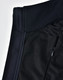 A close-up of a black ladies' softshell hi-tech vest showcasing its fabric textures and a zippered pocket.