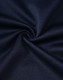 A close-up of dark navy fabric, showing a smooth, textured weave ideal for polo shirts.