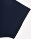 A close-up of a navy polo shirt sleeve with a smooth fabric finish and a subtle logo.