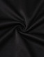 A close-up of black fabric featuring a smooth, textured surface, showcasing its sustainable poly/cotton blend.
