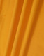 A close-up of fabric featuring a vibrant shade of yellow, showcasing the texture of the material.