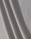 A textured fabric in light grey, showcasing a breathable mesh design suitable for polo shirts.