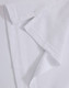 A close-up of a white polo shirt fabric, showcasing the collar and stitching details. Contains a logo.