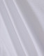 A close-up of white fabric showcasing a smooth texture, suitable for a polo shirt. It has a logo detail.