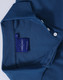A blue ladies' polo shirt featuring a collar, buttons, and a brand label inside.
