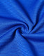 A close-up of blue textured fabric, showcasing a lightweight and performance-oriented material.