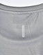 A light grey performance t-shirt featuring a textured pattern and a logo patch on the back.