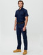 Lightweight semi-fitted work pants in navy, featuring cargo pockets, worn by two individuals in orange shirts.