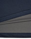 A close-up of a navy blue men's polo shirt featuring a textured fabric with a contrasting inner layer.