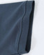 A close-up of a navy blue men's cotton stretch polo shirt, highlighting the fabric and sleeve detail.