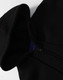 A black men's full-zip fleecy hoodie featuring a hood and a zipper, with a logo visible on the inside.