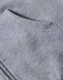A light grey men's full-zip fleecy hoodie with a front pocket and soft, textured fabric. Features branding.