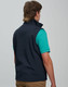 A navy men's softshell vest with a high collar, featuring a logo, shown from the back.