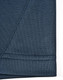 A close-up of a dark blue polo shirt fabric showing the seam detail and texture, featuring a logo.