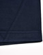 A close-up of a navy blue polo shirt featuring contrast stitching and a logo.