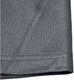A close-up of the hem and fabric of a grey men's sustainable polo shirt, featuring a stitched edge.