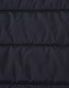 A close-up of a navy blue insulated puffer jacket fabric with a stitched, quilted pattern and a logo.