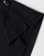 A black polo shirt with a short collar and branded tag detailing at the neckline.
