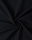 A close-up of black fabric in a swirling pattern, showcasing the texture and weave of the material.