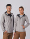 A grey men's waterproof performance jacket with a hood, featuring a logo, displayed on a male and female model.