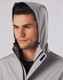 Men's waterproof performance jacket in grey, featuring a hood and branding. Suitable for rain protection.