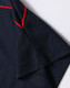 Men's short-sleeve polo shirt in navy blue with red accents. Features a logo on the collar.