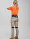 Light beige work pants featuring a stretch design and a black waistband, paired with an orange shirt. The image has a logo.