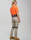 Work pants in beige with navy accents, paired with an orange shirt, displayed from the back. Features a logo.