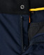 A close-up of navy Rip-Stop Poly/Cotton Stretch Work Pants, showcasing the zipper and fabric texture. Features a logo.